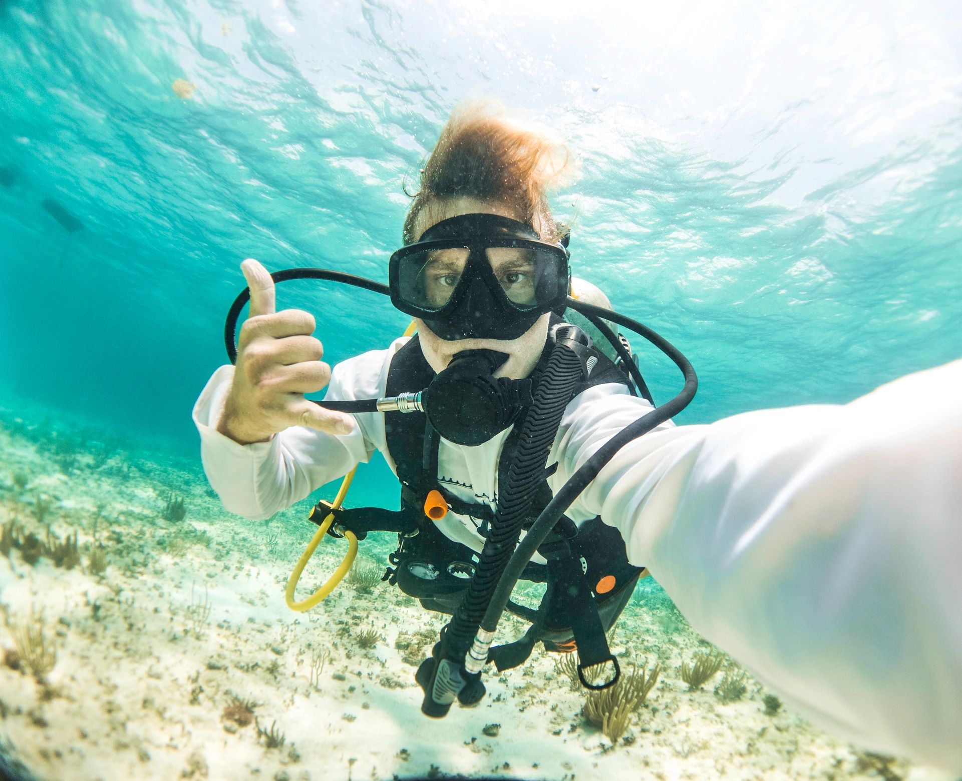Preparing scuba gear by the water